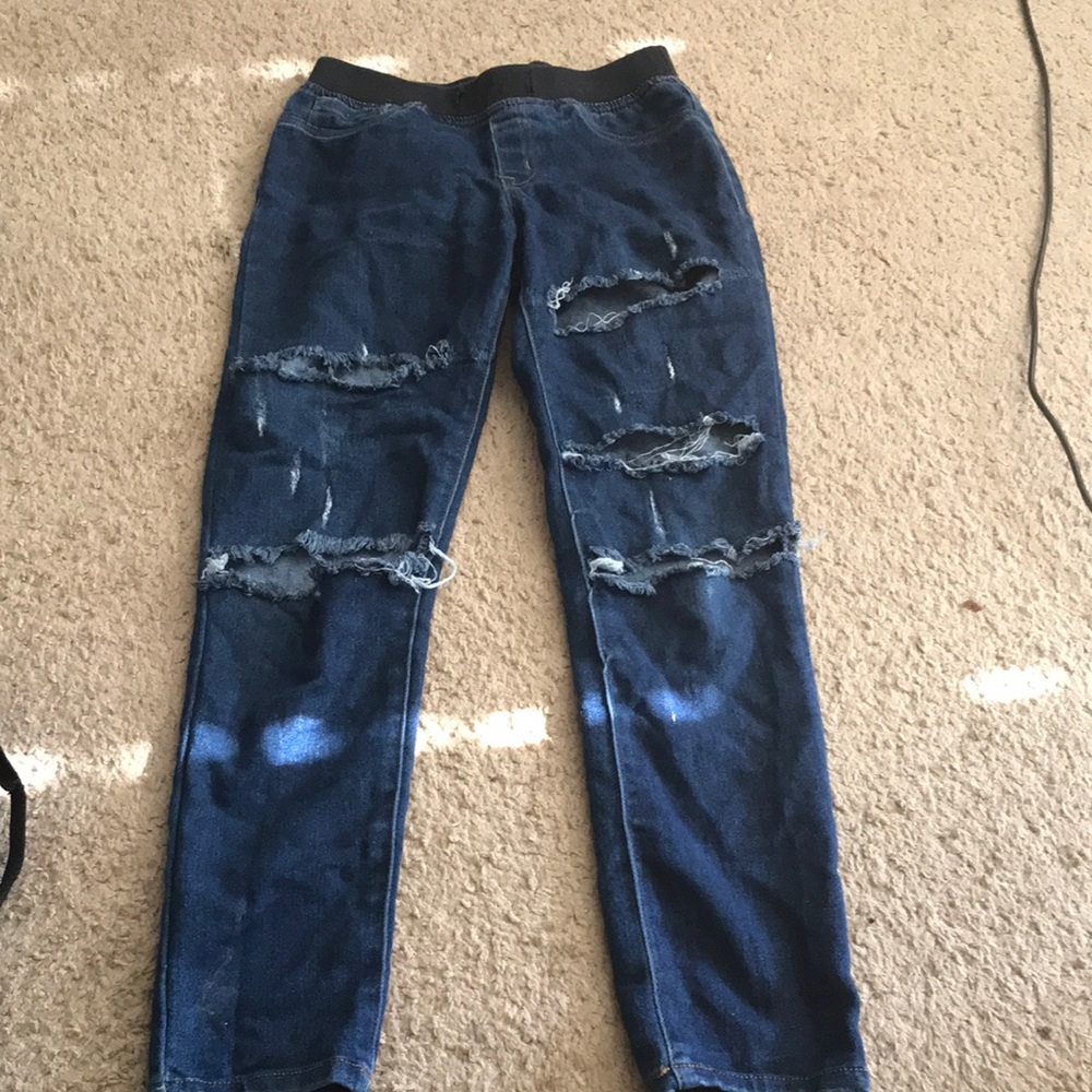 Dark blue jeans with holes